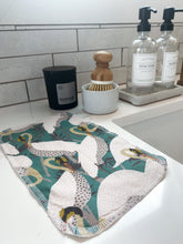 Load image into Gallery viewer, unpaper towel displayed by farmhouse sink in art deco heron print for midcentury modern kitchen in eco-friendly home
