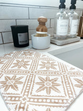 Load image into Gallery viewer, neutral geometric reusable cleaning cloth to replace paper towels displayed with bamboo cleaning brush and eco-friendly kitchen products