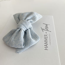 Load image into Gallery viewer, mist blue linen handmade pinwheel hair bow, light blue homespun linen baby bow on nylon hair clip or hair clip, sustainable small shop, eco-friendly hair bow, handamde in the USA, boho vintage modern small shop, women-owned small shop, classy classic modern kids clothes, handmade bow company, fabric bows