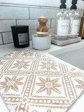Load image into Gallery viewer, neutral geometric reusable cleaning cloth to replace paper towels displayed with bamboo cleaning brush and eco-friendly kitchen products
