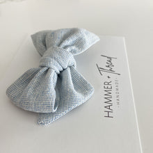 Load image into Gallery viewer, mist blue linen handmade pinwheel hair bow, light blue homespun linen baby bow on nylon hair clip or hair clip, sustainable small shop, eco-friendly hair bow, handamde in the USA, boho vintage modern small shop, women-owned small shop, classy classic modern kids clothes, handmade bow company, fabric bows
